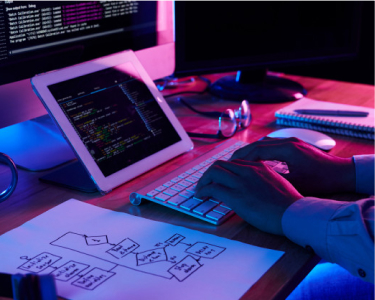 Desktop view with computer, tablet, other hardware components.